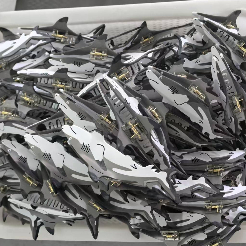 How does NueShiny manufacture its cellulose acetate hair accessories?